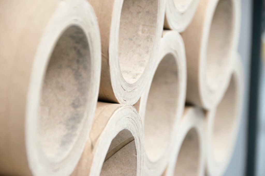 Stack of thick cardboard tubes